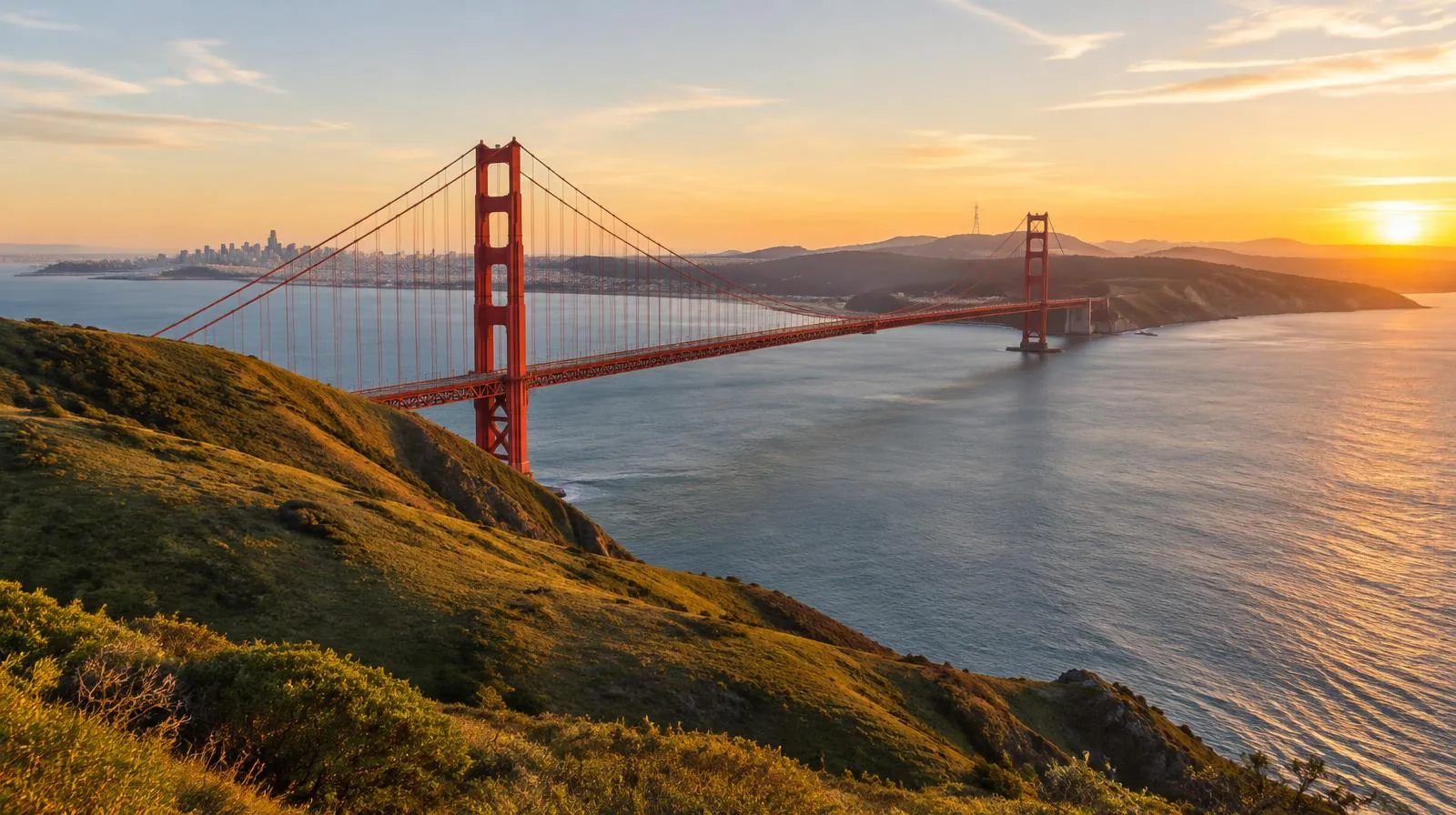 Golden Gate Bridge and coastal hills in California at golden hour
